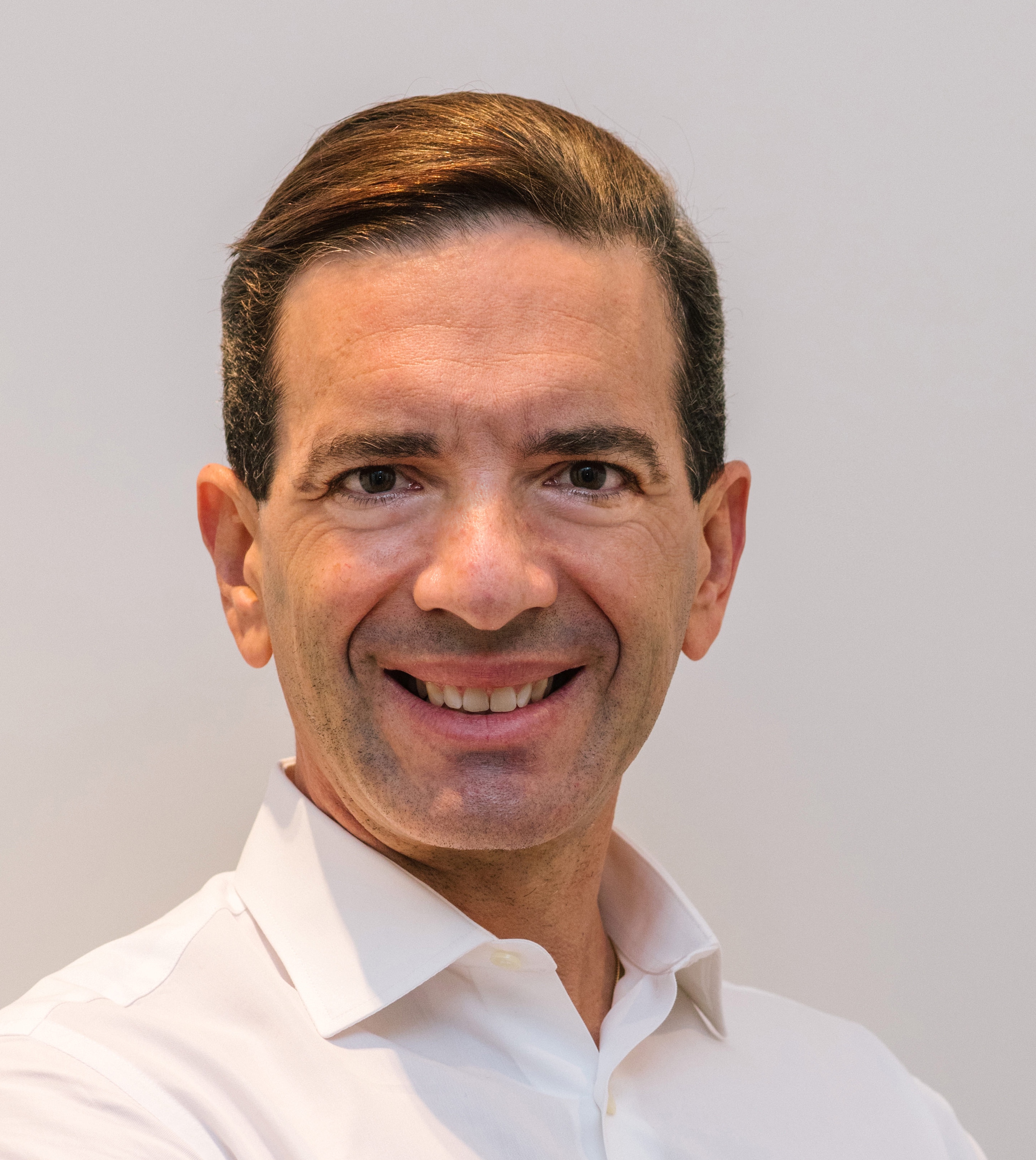 Luis Rodriguez Baptista smiling in a white shirt